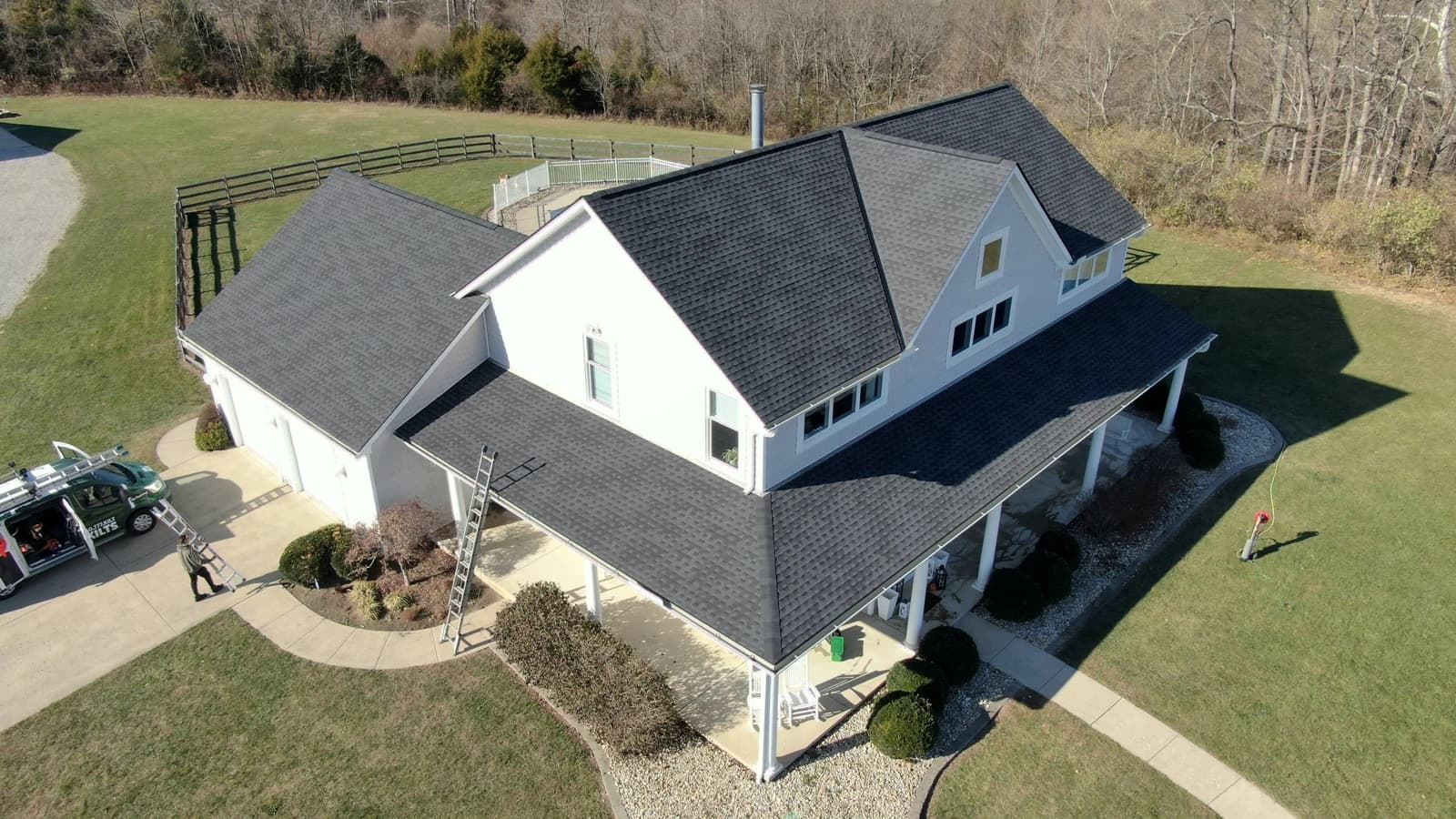 Rooflines of suburban houses with dark and brown architectural asphalt shingles